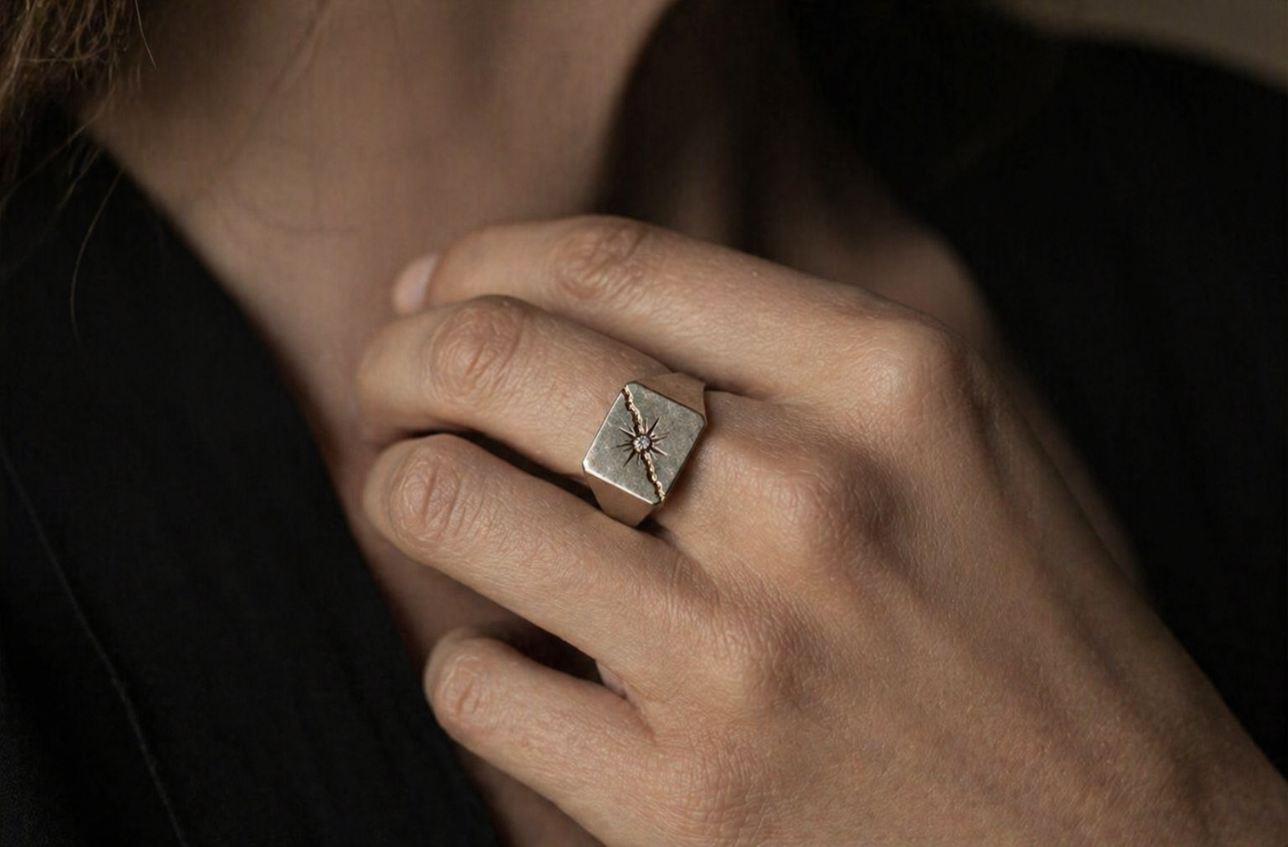 Luxury salt and pepper diamond compass ring on hand